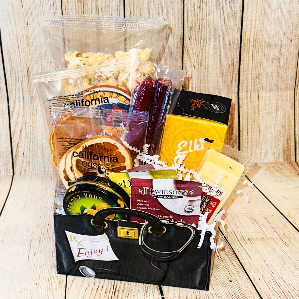 A gift basket with a red bow containing dried fruits, caramel popcorn, crackers, cheese, meat sticks, hard candies, and tea bags.