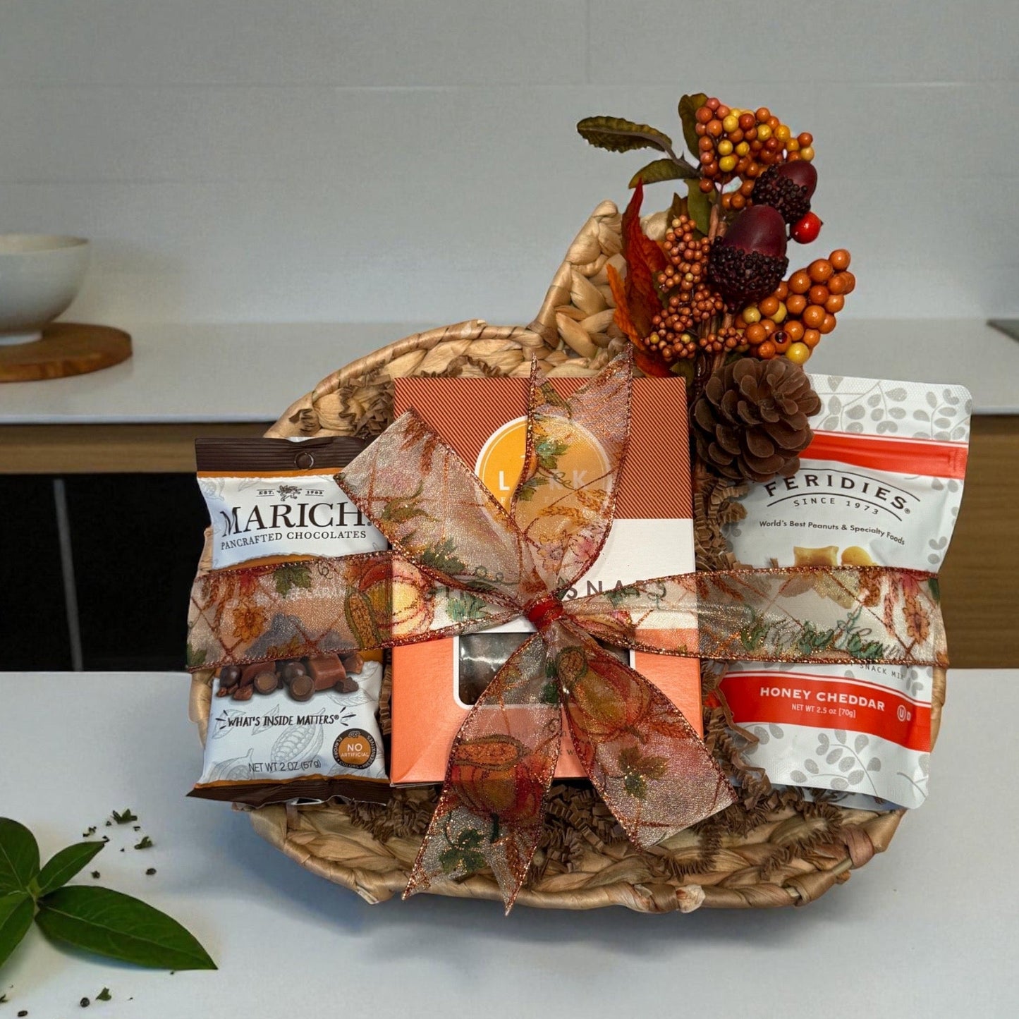 Decorative plate with fall-themed packaging on a kitchen counter