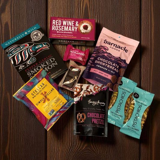 Assorted snack packages on a wooden surface