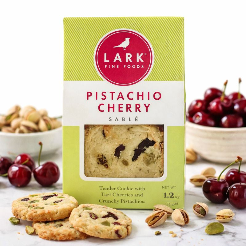 Lark Fine Foods Pistachio Cherry Sable packaging with cookies and ingredients on a white background