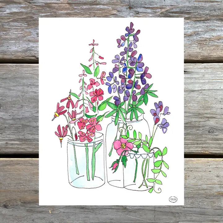 A colorful note card featuring a watercolor illustration of flowers