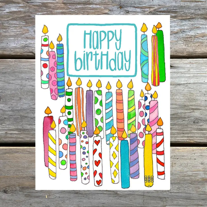 A colorful note card featuring a watercolor illustration of birthday candles