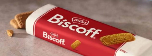 A package of Biscoff cookies, with one cookie partially visible, showing the brand name and the word 'biscuit' on the packaging.