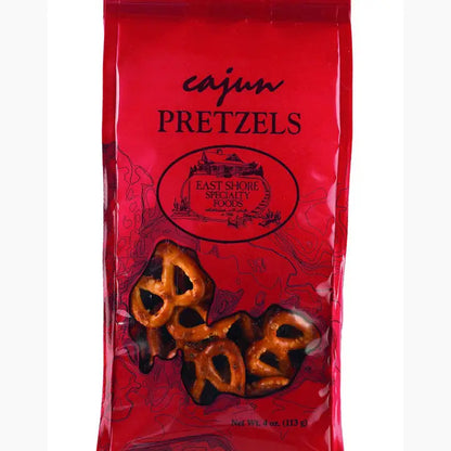 Red bag of Cajun Pretzels with pretzel illustrations on a white background