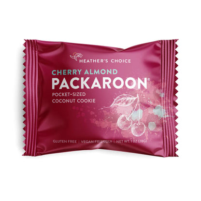 Heather's Choice Cherry Almond Packaroon in magenta wrapper, gluten-free, vegan, 1 oz coconut cookie, ideal for on-the-go snacking.