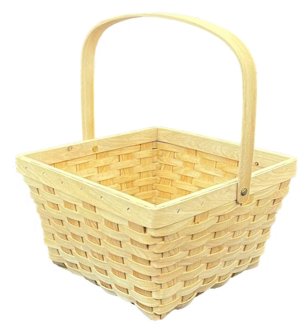 A large, square, handled basket made of light beige wicker with a smooth, natural finish and a matching handle.