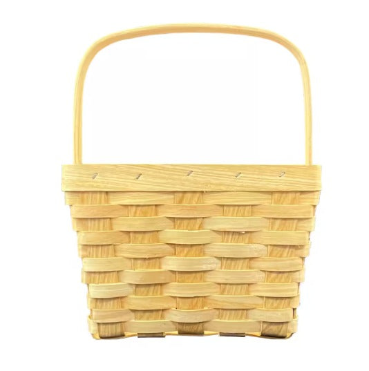 A medium handled basket made of light beige wicker with a solid pattern and a single handle on top.