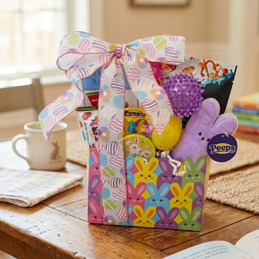 Easter gift basket with colorful packaging and Peeps candy on a wooden table.