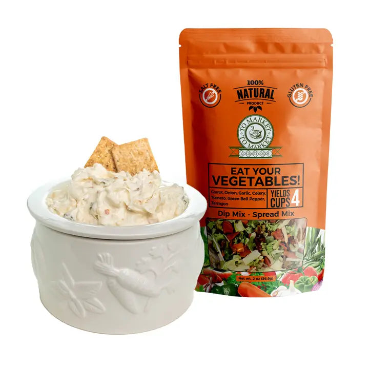 Dip mix in a bowl with a package labeled 'Eat Your Vegetables!' on a white background