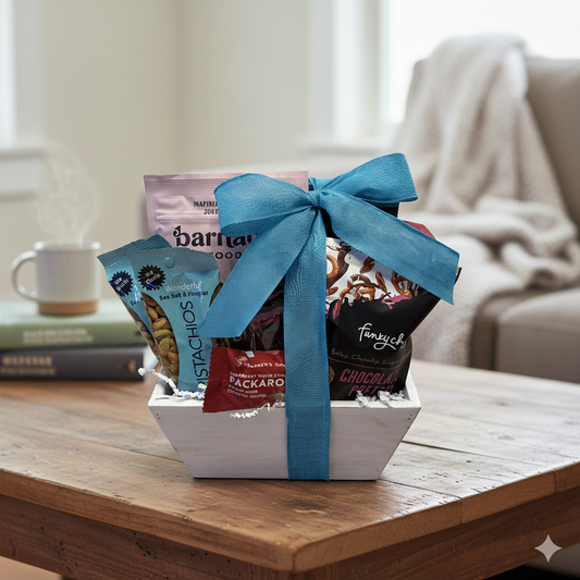 Edibles Gift Basket on a table, featuring gourmet snacks like Funky Chunky pretzels and Wonderful pistachios, wrapped with a blue ribbon, cozy backdrop.