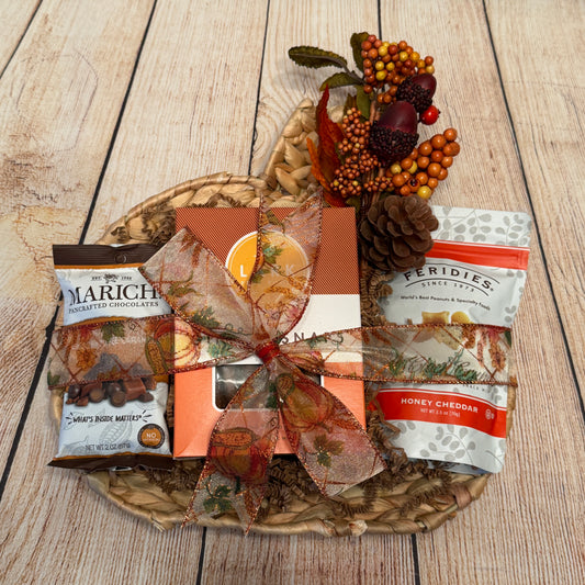 Gift basket with Marich chocolates, Ginger snaps, and Feridies snack mix on apumpkinn tray