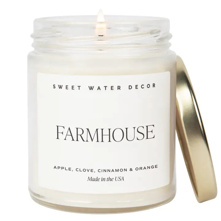 Candle in a jar with Farmhouse label on a white background. Scent is Apple, Clove, Cinnamon and Orange