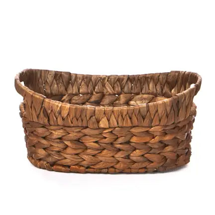 Hyacinth Oval basket, hand-woven, empty, and oval-shaped, ideal for organizing. Dimensions: 10 L x 6.75 W x 4.75 H.