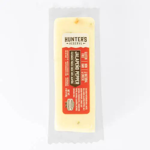 Block of Jalapeno Pepper cheese with a Hunter's Reserve label on a white background