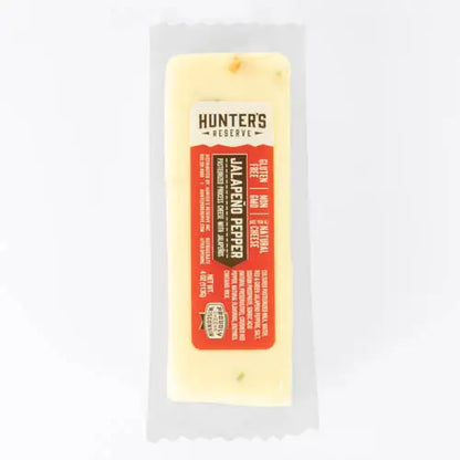 Block of Jalapeno Pepper cheese with a Hunter's Reserve label on a white background