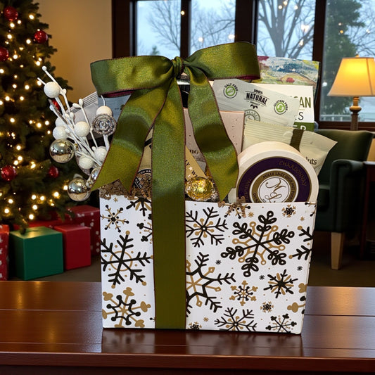 Gift basket with a green ribbon in front of a decorated Christmas tree