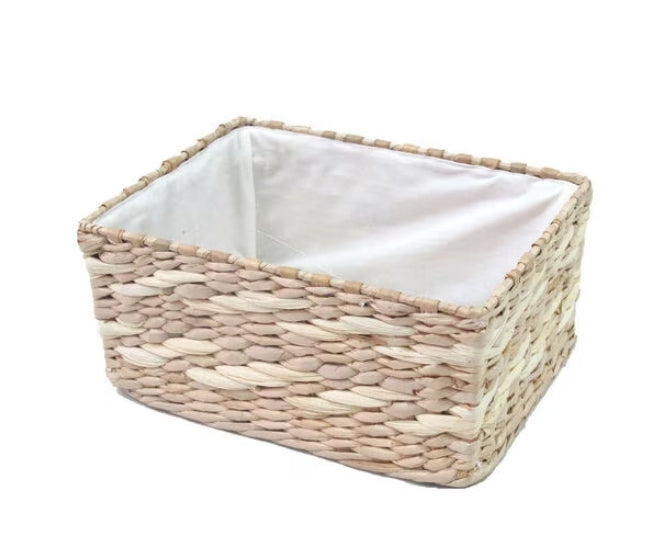 A beige natural woven basket with a white lined interior.