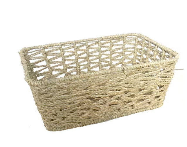 A beige seagrass weave basket with a rectangular shape, displayed against a white background.