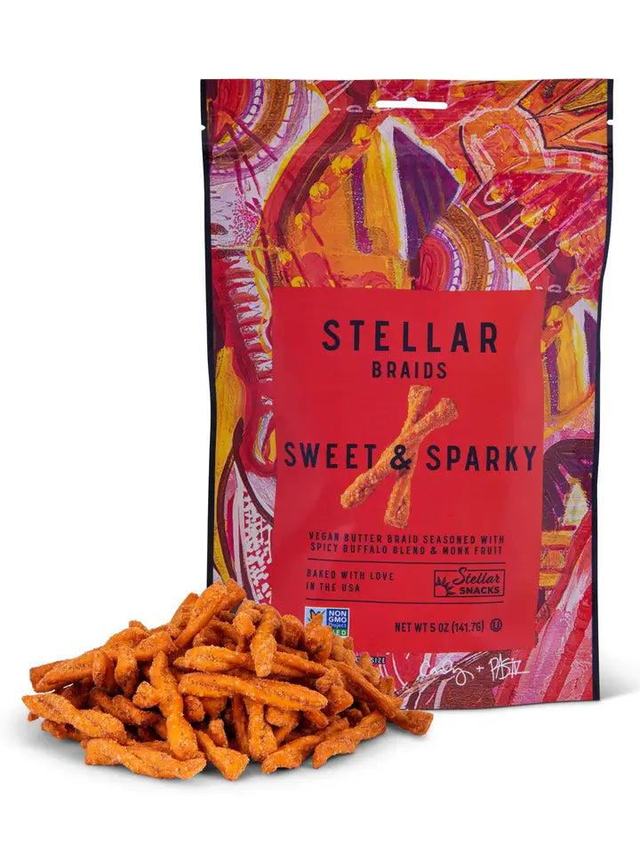 Stellar Braids Sweet & Sparkly snack package with snacks in front on a white background