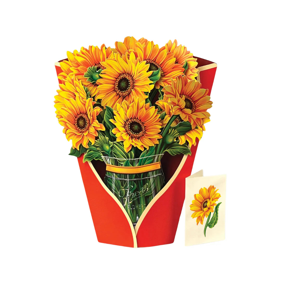 Pop-up Flower Bouquets featuring vibrant sunflowers in a glass vase wrapped in red paper, with a sunflower-themed greeting card, made from 100% recycled materials.