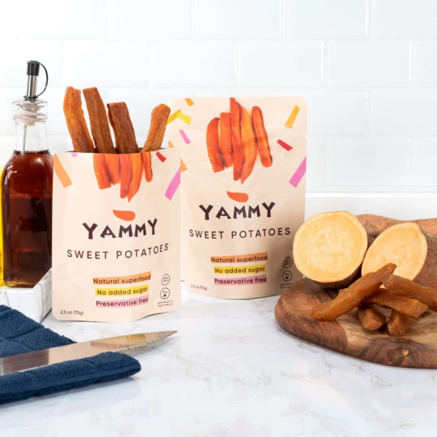 Yummy Sweet Potatoes packaging with sliced sweet potatoes on a cutting board.
