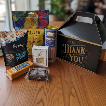Thank You Gable Box with pretzels, wafer rolls, snack nuts, herbal tea, cheddar cheese, and a brownie, perfect for gifting sweet and savory treats.