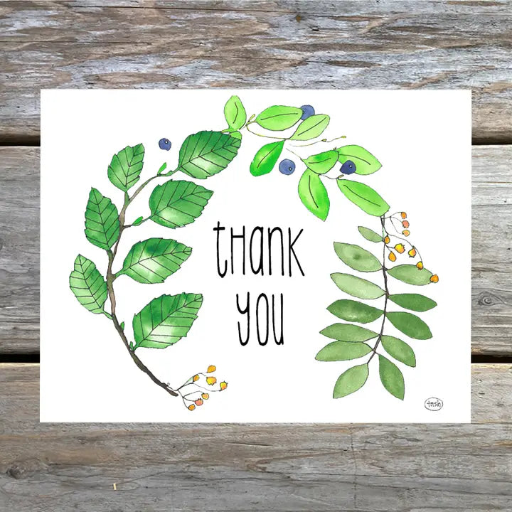 A colorful note card featuring a watercolor illustration of leaves and a thank you message