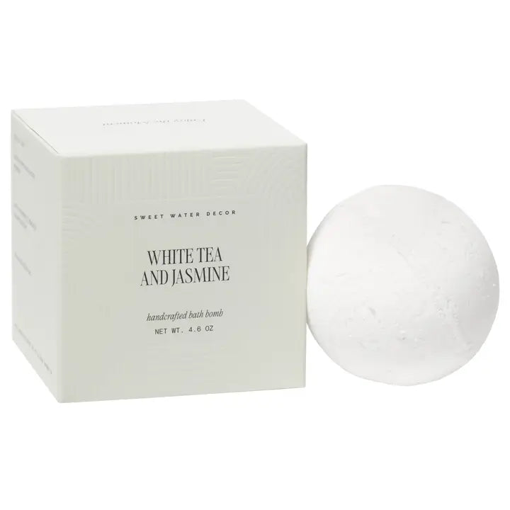 White tea and jasmine bath bomb with packaging on a white background