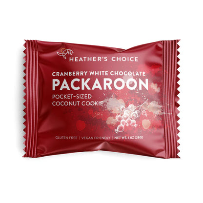 Heather's Choice Packaroons in a red wrapper, labeled as Cranberry White Chocolate Coconut Cookie, gluten-free, vegan, 1 oz. Ideal for on-the-go snacking.
