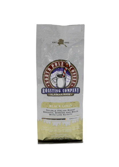 A package of North Pole Blend coffee by The Roasting Company with a white and red design, featuring an image of a polar bear and a pine tree.